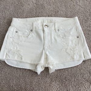 American Eagle white distressed shorts